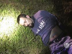 This photo provided by the Limestone County Sheriff's Office posted on Twitter shows Mickey Paulk under arrest Thursday, June 27, 2019, in Killen, Ala. Authorities had been seeking Paulk on multiple felony warrants unrelated to the squirrel named Deeznutz, made infamous after police said they were warned about a meth-fueled, trained attack squirrel. (Limestone County Sheriff's Office via AP)