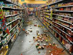 Food that fell from the shelves litters the floor of an aisle at a Walmart following an earthquake in Yucca Yalley, Calif., on Friday, July 5, 2019. (Chad Mayes via AP)