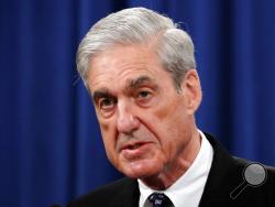 FILE - In this May 29, 2019, file photo, Special counsel Robert Mueller speaks at the Department of Justice in Washington, about the Russia investigation. House Democrats say preparations for next week's testimony by the special counsel in the Russia investigation include re-reading the report and watching old video of Mueller's testimony on other matters. (AP Photo/Carolyn Kaster, File)