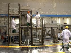 In this photo taken on Tuesday, July 16, 2019, workers work continues to dismantle a Reactor 1 Hall of Ignalina Nuclear Power Plant (NPP) in Visaginas some 160km (100 miles) northeast of the capital Vilnius, Lithuania. The HBO TV series “Chernobyl” featuring Soviet era nuclear nightmares is drawing tourists to the atomic filming locations in Lithuania. (AP Photo/Mindaugas Kulbis)