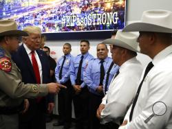 President Donald Trump speaks to first responders as he visits the El Paso Regional Communications Center after meeting with people affected by the El Paso mass shooting, Wednesday, Aug. 7, 2019, in El Paso, Texas. (AP Photo/Evan Vucci)