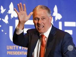 FILE - In this May 31, 2019, file photo, Democratic presidential candidate Washington Gov. Jay Inslee waves after speaking during a campaign event at the Unity Freedom Presidential Forum in Pasadena, Calif. Inslee, who made fighting climate change the central theme of his presidential campaign, announced Wednesday night, Aug. 21, that he is ending his bid for the 2020 Democratic nomination. (AP Photo/Chris Carlson, File)