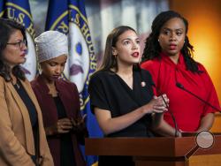 FILE - In this July 15, 2019, file photo, from left, Rep. Rashida Tlaib, D-Mich., Rep. Ilhan Omar, D-Minn., Rep. Alexandria Ocasio-Cortez, D-N.Y., and Rep. Ayanna Pressley, D-Mass., speak at the Capitol in Washington. All are American citizens and three of the four were born in the U.S. President Donald Trump told American congresswomen of color to “go back” to where they came from. He later vowed to revive a racial slur to tear down Elizabeth Warren, promoted a wild conspiracy theory linking a past politic