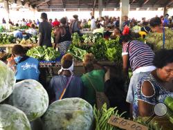 In this Nov. 24, 2018, photo, customers shop for vegetables at the Honiara Central Market in Honiara, the capital of the Solomon Islands. The Solomon Islands switched diplomatic recognition from Taiwan to China on Monday, Sept. 16, 2019, becoming the latest country to leave the dwindling Taiwanese camp.(AP Photo/Mark Schiefelbein)