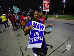 United Auto Workers members picket outside the General Motors Detroit-Hamtramck assembly plant in Hamtramck, Mich., early Monday, Sept. 16, 2019. Roughly 49,000 workers at General Motors plants in the U.S. planned to strike just before midnight Sunday, but talks between the UAW and the automaker will resume. (AP Photo/Paul Sancya)