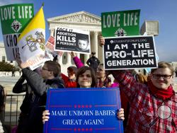 FILE - In this Jan. 18, 2019, file photo, anti-abortion activists protest outside of the U.S. Supreme Court, during the March for Life in Washington. The number and rate of abortions across the United States have plunged to their lowest levels since the procedure became legal nationwide in 1973, according to new figures released Wednesday, Sept. 18. (AP Photo/Jose Luis Magana, File)