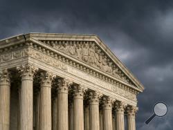 FILE - In this June 20, 2019, file photo, the Supreme Court in Washington. The Supreme Court is set to hear arguments in two of the term’s most closely watched cases over whether federal civil rights law protects LGBT people from job discrimination. The cases Tuesday, Oct. 8, are the court’s first on LGBT rights since Justice Anthony Kennedy’s retirement and replacement by Justice Brett Kavanaugh.(AP Photo/J. Scott Applewhite, File)