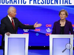 Democratic presidential candidate former Vice President Joe Biden, gestures toward Sen. Elizabeth Warren, D-Mass., during a Democratic presidential primary debate hosted by CNN/New York Times at Otterbein University, Tuesday, Oct. 15, 2019, in Westerville, Ohio. (AP Photo/John Minchillo)
