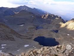 This undated photo provided by the Inyo County Sheriff's Department shows 6th lake below Mount Williamson where authorities say the skeletal remains of a person were discovered on Oct. 7, 2019 beneath the state's second-highest peak. The body was discovered by climbers last week who saw what appeared to be a bone beneath boulders. High winds prevented a helicopter from retrieving the body until Wednesday, Oct. 16, 2019, Roper says the body may have been there for decades based on its condition. (Inyo Sherif
