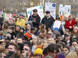 Climate change activists gather for a march and rally with Swedish climate activist Greta Thunberg at the Alberta Legislature Building in Edmonton, Alberta, on Friday, Oct. 18, 2019. (Dave Chidley/The Canadian Press via AP)