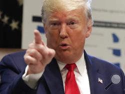 President Donald Trump gestures while speakings during a Cabinet meeting in the Cabinet Room of the White House, Monday, Oct. 21, 2019, in Washington. (AP Photo/Pablo Martinez Monsivais)