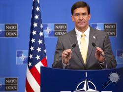 U.S. Secretary for Defense Mark Esper speaks during a media conference after a meeting of NATO defense ministers at NATO headquarters in Brussels, Friday, Oct. 25, 2019. NATO defense ministers on Friday discussed efforts to deter Russia in eastern Europe and the future of the mission training security forces in Afghanistan. (AP Photo/Virginia Mayo)