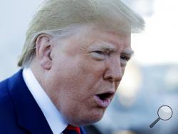 President Donald Trump talks to reporters before boarding Air Force One for a trip to Chicago to attend the International Association of Chiefs of Police Annual Conference and Exposition, Monday, Oct. 28, 2019, in Andrews Air Force Base, Md. (AP Photo/Evan Vucci)