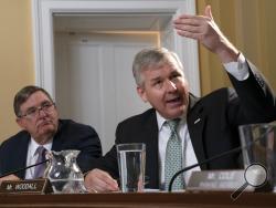 Rep. Rob Woodall, R-Ga., joined at left by Rep. Michael Burgess, R-Texas, objects to the resolution put forth by House Rules Committee Chairman Jim McGovern, D-Mass., at a markup that will formalize the next steps in the impeachment inquiry of President Donald Trump, in his office at the Capitol in Washington, Wednesday, Oct. 30, 2019. Democrats have been investigating Trump's withholding of military aid to Ukraine as he pushed the country's new president to investigate Democrats and the family of rival pre