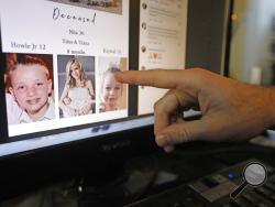 Austin Cloes points to a photo of relatives Rhonita Miller and her family, who were killed in Mexico, on a computer screen Tuesday, Nov. 5, 2019, in Herriman, Utah. Drug cartel gunmen ambushed three SUVs along a dirt road, slaughtering at least six children and three women all of them U.S. citizens living in northern Mexico in a grisly attack that left one vehicle a burned-out, bullet-riddled hulk, authorities said Tuesday, Nov. 5, 2019. (AP Photo/Rick Bowmer)