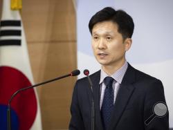 South Korean Unification Ministry spokesman Lee Sang-min briefs the media at a government complex in downtown Seoul, South Korea, Thursday, Nov. 7, 2019. South Korea says it has deported 2 North Koreans after finding they had killed 16 fellow fishermen onboard and fled to South Korea. (Kim Seung-doo/Yonhap via AP)
