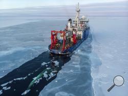 In this Nov. 14, 2019, photo provided by John Guillote and taken from an aerial drone shows the U.S. research vessel Sikuliaq as it makes its way through sea ice in the Beaufort Sea off Alaska's north coast. University of Washington scientists onboard the research vessel are studying the changes and how less sea ice will affect coastlines, which already are vulnerable to erosion because increased waves delivered by storms. More erosion would increase the chance of winter flooding in villages and danger to h