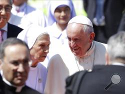 Pope Francis talks to his cousin Ana Rosa Sivori as he arrives at Military Air Terminal of Don Muang Airport, Wednesday, Nov. 20, 2019, in Bangkok, Thailand. (AP Photo/Gregorio Borgia)