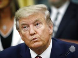 President Donald Trump participates in a bill signing ceremony for the Preventing Animal Cruelty and Torture Act in the Oval Office of the White House, Monday, Nov. 25, 2019, in Washington. (AP Photo/Patrick Semansky)