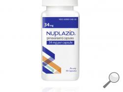 This undated photo provided by Acadia Pharmaceuticals Inc. shows a bottle of Nuplazid, a drug that was tested for treating psychosis related to dementia. If regulators agree, the drug could become the first treatment specifically for dementia-related psychosis and the first new medicine for Alzheimer's in nearly two decades. Results from a study on the drug were disclosed Wednesday, Dec. 4, 2019, at an Alzheimer's conference in San Diego. (Acadia Pharmaceuticals Inc. via AP) 