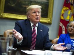 Barb Smith, President, Journey Steel, Inc., right, listens President Donald Trump speaks during a small business roundtable in the Roosevelt Room of the White House, Friday, Dec. 6, 2019, in Washington. (AP Photo/ Evan Vucci)