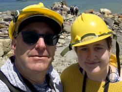 In this Monday, Dec. 9, 2019, photo provided by Lillani Hopkins, Lillani Hopkins pictured with her father Geoff prior to the eruption on White Island off the coast of Whakatane, New Zealand. Lillani Hopkins was feeling seasick and keeping her eyes trained on the open water as her tour boat swung around for a last view of the White Island volcano on Monday afternoon, Dec 9, 2019. Suddenly people started gasping and then her dad whacked her, telling her to turn around. The eruption had been so silent she hadn