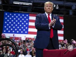 President Donald Trump arrives for a campaign rally at Kellogg Arena, Wednesday, Dec. 18, 2019, in Battle Creek, Mich. (AP Photo/ Evan Vucci)