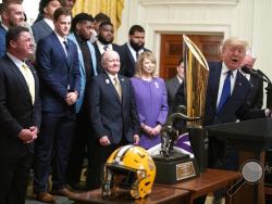 President Donald Trump speaks during an event to honor the NCAA football national champion Louisiana State University Tigers, in the East Room of the White House, Friday, Jan. 17, 2020, in Washington. (AP Photo/ Evan Vucci)