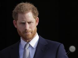 In this Thursday, Jan. 16, 2020, file photo, Britain's Prince Harry arrives in the gardens of Buckingham Palace in London. Prince Harry said Sunday, Jan. 19 that he felt “great sadness” but found “no other option” to cutting almost all of his and his wife Meghan’s royal ties in the hopes of achieving a more peaceful life. (AP Photo/Kirsty Wigglesworth, File)
