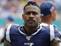 FILE - In this Sunday, Sept. 15, 2019, file photo, New England Patriots wide receiver Antonio Brown (17) on the sidelines,during the first half at an NFL football game against the Miami Dolphins in Miami Gardens, Fla. Authorities say NFL wide receiver Antonio Brown's trainer has been arrested following accusations that he and Brown attacked another man near Brown's Florida home. Hollywood police say officers responded to a disturbance call Tuesday, Jan. 21, 2020 where the alleged victim said Brown and his t