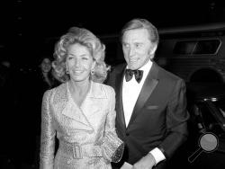 FILE - This Nov. 5, 1971 file photo shows actor Kirk Douglas and his wife Anne at the premier of "Fiddler on the Roof" in Los Angeles. Kirk Douglas died Wednesday, Feb. 5, 2020 at age 103. (AP Photo/Harold Filan, File)
