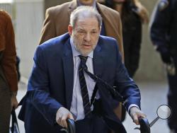 Harvey Weinstein arrives at a Manhattan courthouse for his rape trial in New York, Friday, Feb. 14, 2020. (AP Photo/Seth Wenig)