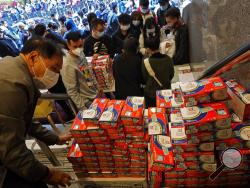 FILE - In this Feb. 5, 2020, file photo, citizens line up to buy face masks in Hong Kong. Fear of the spreading coronavirus has led to a global run on sales of face masks despite medical experts' advice that most people who aren't sick don't need to wear them. (AP Photo/Vincent Yu, File)