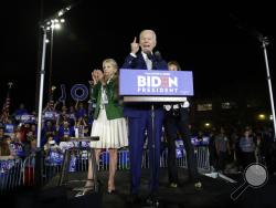 Democratic presidential candidate former Vice President Joe Biden speaks, next to his wife Jill during a primary election night rally Tuesday, March 3, 2020, in Los Angeles. (AP Photo/Marcio Jose Sanchez)