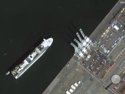 In this satellite image provided by Maxar Technologies, the Grand Princess cruise ship is seen as it was preparing to dock at the Port of Oakland in Oakland, Calif., Monday, March 9, 2020. The cruise ship forced to idle for days off the coast of California because of a cluster of novel coronavirus cases aboard arrived in port Monday as state and U.S. officials prepared to transfer its thousands of passengers to military bases for quarantine or return them to their home countries. (Satellite image ©2020 Maxa