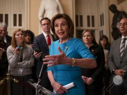 Speaker of the House Nancy Pelosi, D-Calif., makes a statement ahead of a planned late-night vote on the coronavirus aid package deal at the Capitol in Washington, Friday, March 13, 2020. (AP Photo/J. Scott Applewhite)