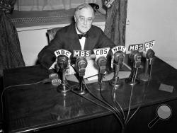 FILE - In this Feb. 27, 1941 file photo President Franklin D. Roosevelt speaks on the radio from the Oval Room of the White House. During an extraordinary 12 years in office, Roosevelt guided the nation through a bleak period of Depression-era unemployment, a severe Midwest drought known as the Dust Bowl and battle against the Nazis and Japanese in World War II. (AP Photo/Henry Griffin, File)