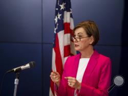 Iowa Governor Kim Reynolds speaks to the press during a news conference on Sunday, March 29, 2020, about the coronavirus COVID-19 and the state's response from the State Emergency Operation Center in Johnston, Iowa. (Kelsey Kremer/The Des Moines Register via AP, Pool)