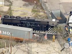 This aerial image taken from video provided by KABC-TV shows a Pacific Harbor Line train that derailed Tuesday, March 31, 2020, at the Port of Los Angeles after running through the end of the track and crashing through barriers, finally coming to rest about 250 yards from the docked U.S. Navy Hospital Ship Mercy. The train engineer intentionally drove the speeding locomotive off a track at the Port of Los Angeles because he was suspicious about the presence of a Navy hospital ship docked there amid the coro