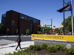 FILE - In this May 15, 2019, file photo Drexel University in Philadelphia. Students at more than 25 universities are filing lawsuits demanding tuition refunds from their schools after finding that the online classes they are being offered do not match up to the classroom experience. Grainger Rickenbaker, a freshman who filed a class action lawsuit against Drexel University in Philadelphia, said the online classes he’s been taking are poor substitutes for classroom learning. (AP Photo/Matt Rourke, File)