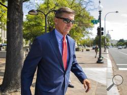 FILE - In this Sept. 10, 2019 file photo, Michael Flynn, President Donald Trump's former national security adviser, leaves the federal court following a status conference in Washington. (AP Photo/Manuel Balce Ceneta)