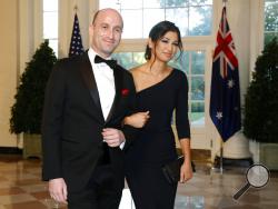 FILE - In this Sept. 20, 2019, file photo President Donald Trump's White House Senior Adviser Stephen Miller, left, and Katie Waldman, now Miller, arrive for a State Dinner with Australian Prime Minister Scott Morrison and President Donald Trump at the White House in Washington. Vice President Mike Pence's press secretary has the coronavirus, the White House said Friday, making her the second person who works at the White House complex known to test positive for the virus this week. Pence spokeswoman Katie 
