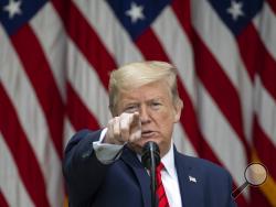 President Donald Trump points to a question as he speaks about the coronavirus during a press briefing in the Rose Garden of the White House, Monday, May 11, 2020, in Washington. (AP Photo/Alex Brandon)