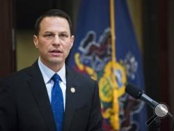 FILE – In this May 14, 2019, file photo, Pennsylvania Attorney General Josh Shapiro speaks during a news conference in Philadelphia. On Tuesday, May 12, 2020, Shapiro announced that he has opened criminal investigations into several nursing homes in the state amid a coronavirus outbreak that has killed 2,600 residents of nursing homes and other facilities that care for older adults. The attorney general's office did not say how many facilities it is investigating, or reveal their names or provide any other 