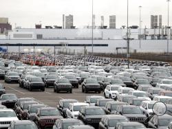 FILE - In this Feb. 26, 2019, file photo, Jeep vehicles are parked outside the Jefferson North Assembly Plant in Detroit. Defying a wave of layoffs that has sent the U.S. job market into its worst catastrophe on record, at least one major industry is making a comeback: Tens of thousands of auto workers are returning to factories that have been shuttered since mid-March due to fears of spreading the coronavirus. (AP Photo/Carlos Osorio, File)