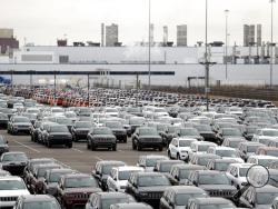 FILE - In this Feb. 26, 2019, file photo, Jeep vehicles are parked outside the Jefferson North Assembly Plant in Detroit. Defying a wave of layoffs that has sent the U.S. job market into its worst catastrophe on record, at least one major industry is making a comeback: Tens of thousands of auto workers are returning to factories that have been shuttered since mid-March due to fears of spreading the coronavirus. (AP Photo/Carlos Osorio, File)