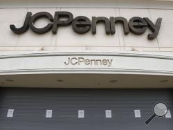 FILE - In this May 8, 2020, file photo, a J.C. Penney store sits closed in Roseville, Mich. The coronavirus pandemic has pushed troubled department store chain J.C. Penney into Chapter 11 bankruptcy. It is the fourth major retailer to meet that fate. Penney said late Friday, May 15, 2020, it will be closing some stores and will be disclosing details and timing in the next few weeks. (AP Photo/Paul Sancya, File)