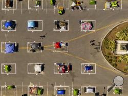 Rectangles designed to help prevent the spread of the coronavirus by encouraging social distancing line a city-sanctioned homeless encampment at San Francisco's Civic Center on Thursday, May 21, 2020. (AP Photo/Noah Berger)