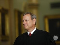FILE - In this Jan. 16, 2020, file photo Chief Justice of the United States, John Roberts walks to the Senate chamber at the Capitol in Washington. Roberts told graduating seniors at his son's high school that the coronavirus has “pierced our illusion of certainty and control" and counseled them to make their way in a world turned upside down with humility, compassion and courage. (AP Photo/Matt Rourke, File)