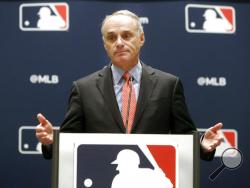 FILE - In this Nov. 21, 2019, file photo, baseball commissioner Rob Manfred speaks to the media at the owners meeting in Arlington, Texas. The chance that there will be no Major League Baseball season increased substantially Monday, June 15, 2020, when the commissioner's office told the players' association it will not proceed with a schedule amid the coronavirus pandemic unless the union waives its right to claim management violated a March agreement between the feuding sides. (AP Photo/LM Otero, File)